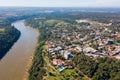 Town of Puerto Iguazu city centre aerial view. Fraternity Bridge border crossing Brazil-Argentina over the Iguassu River.